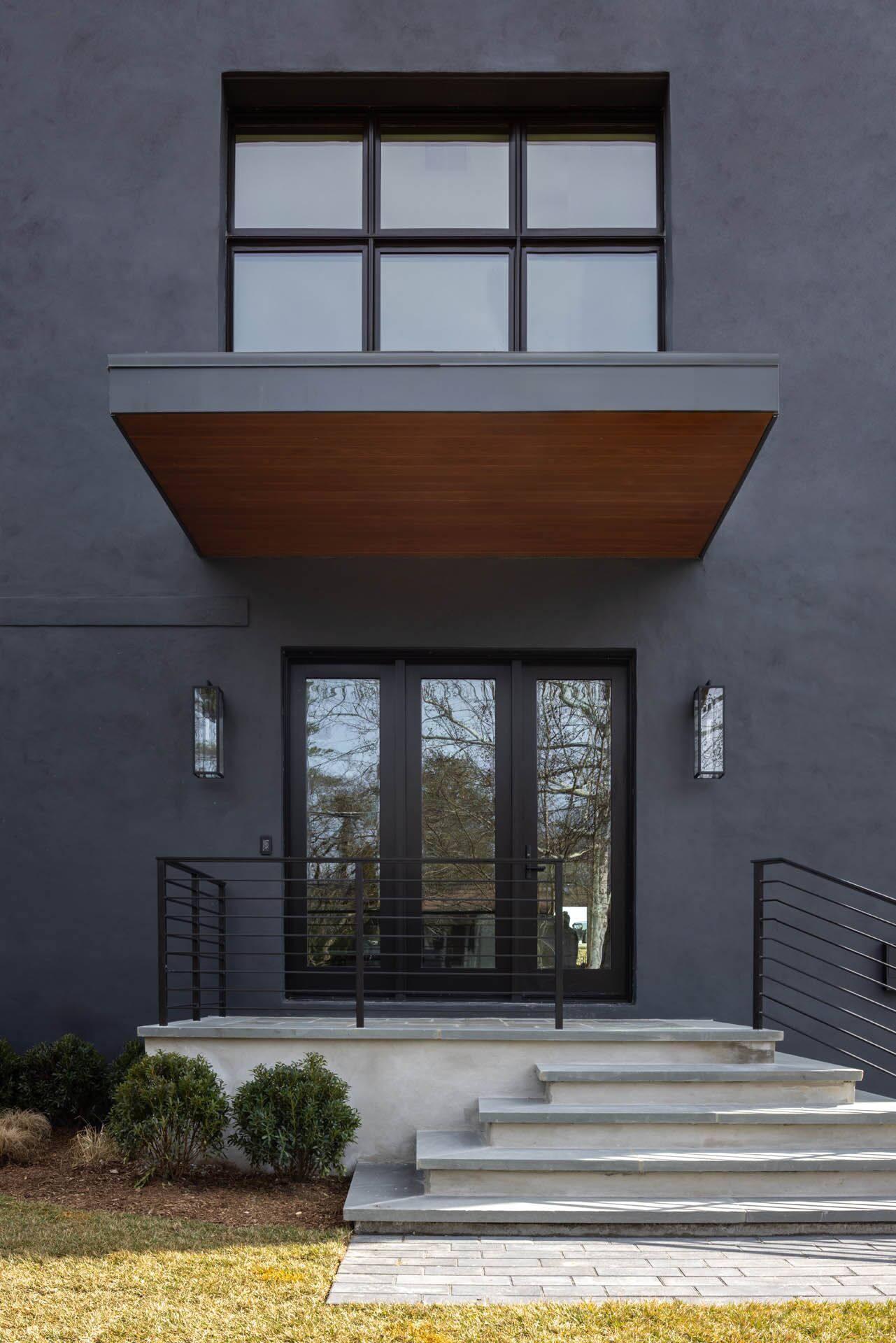 A close-up view of the back porch of a black house
